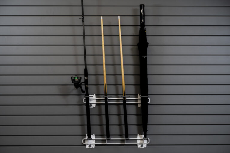 Cue and fishing hook holder on slatwall